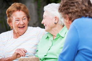 Three elderly women talking
